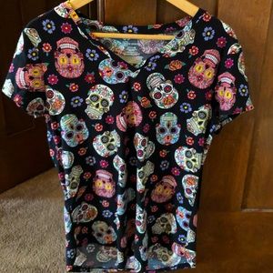 Vintage tee with sugar skulls design. Soft and stretchy. Gently used.
